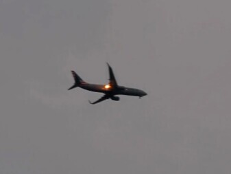 American Airlines flight with engine flame