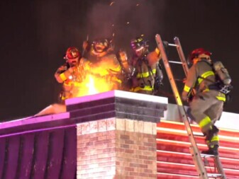 Firefighters Putting Out Chimney Fire